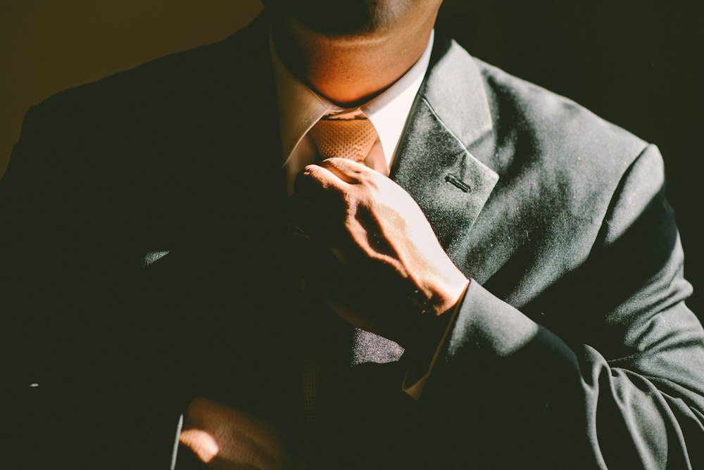 Executive adjusting his tie