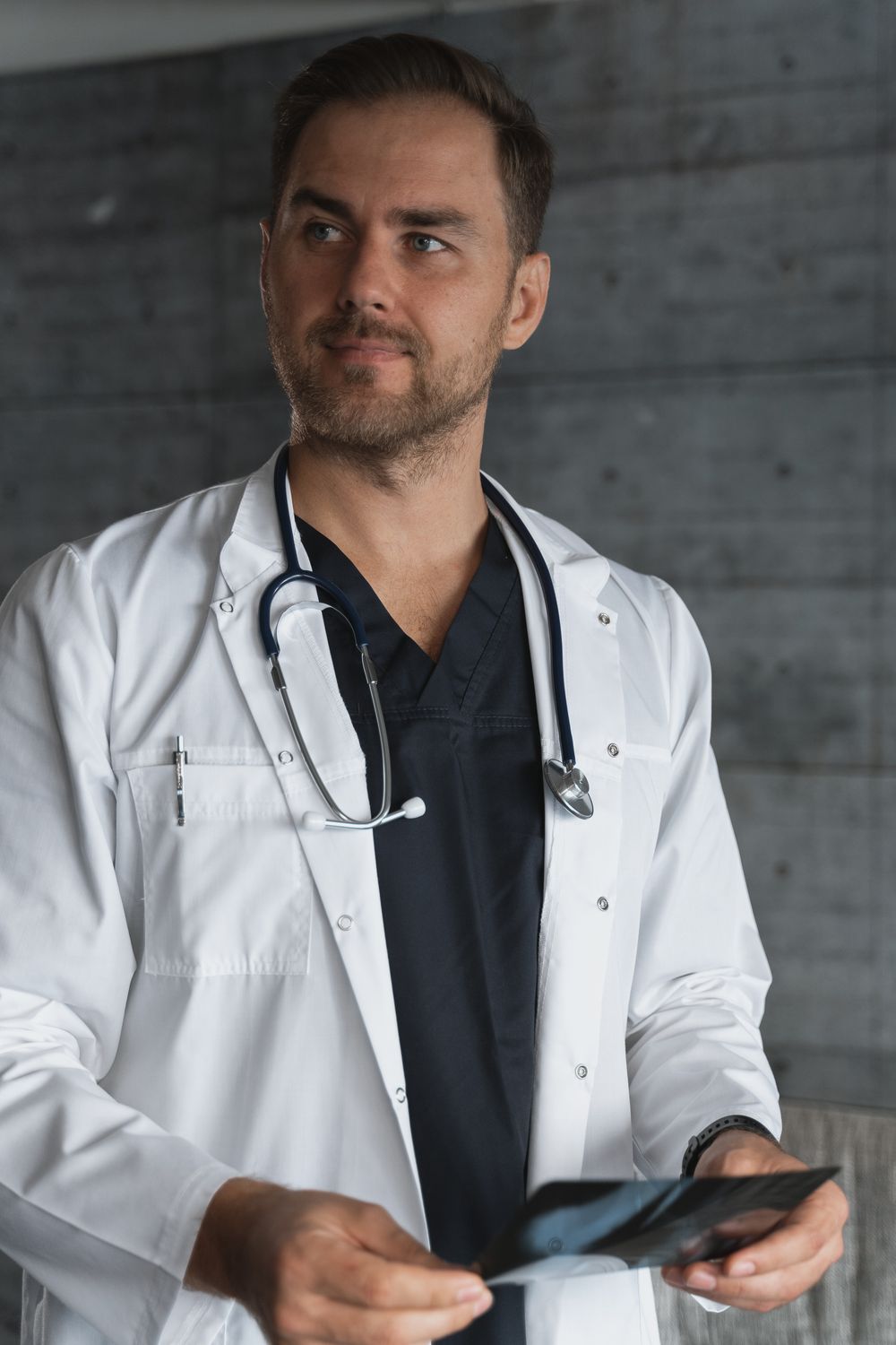 Healthcare professional in a white coat with a stethoscope
